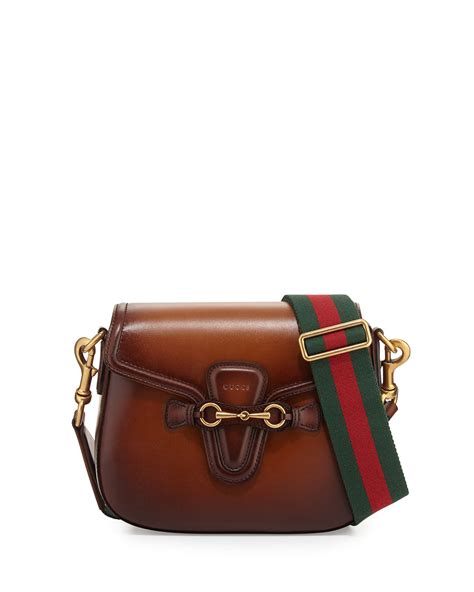 small red gucci crossbody|Gucci crossbody with striped strap.